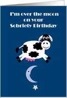 Over the moon blue Sobriety Birthday recovery card with a cute cartoon cow jumping over the moon card